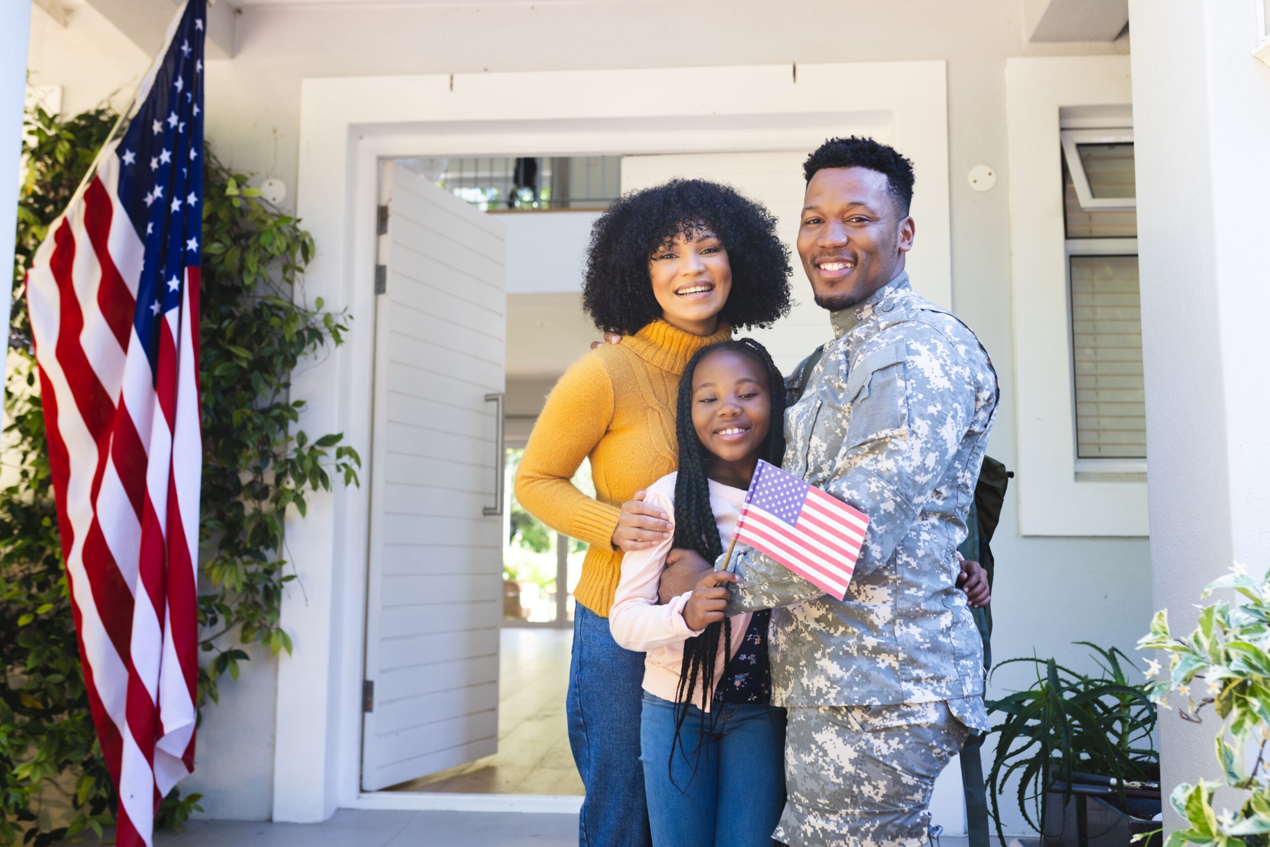 Family outside new home after using VA IRRRL Program