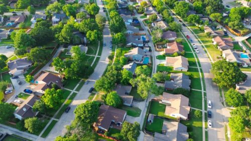 Parallel residential streets with back alleys and row of single-family houses