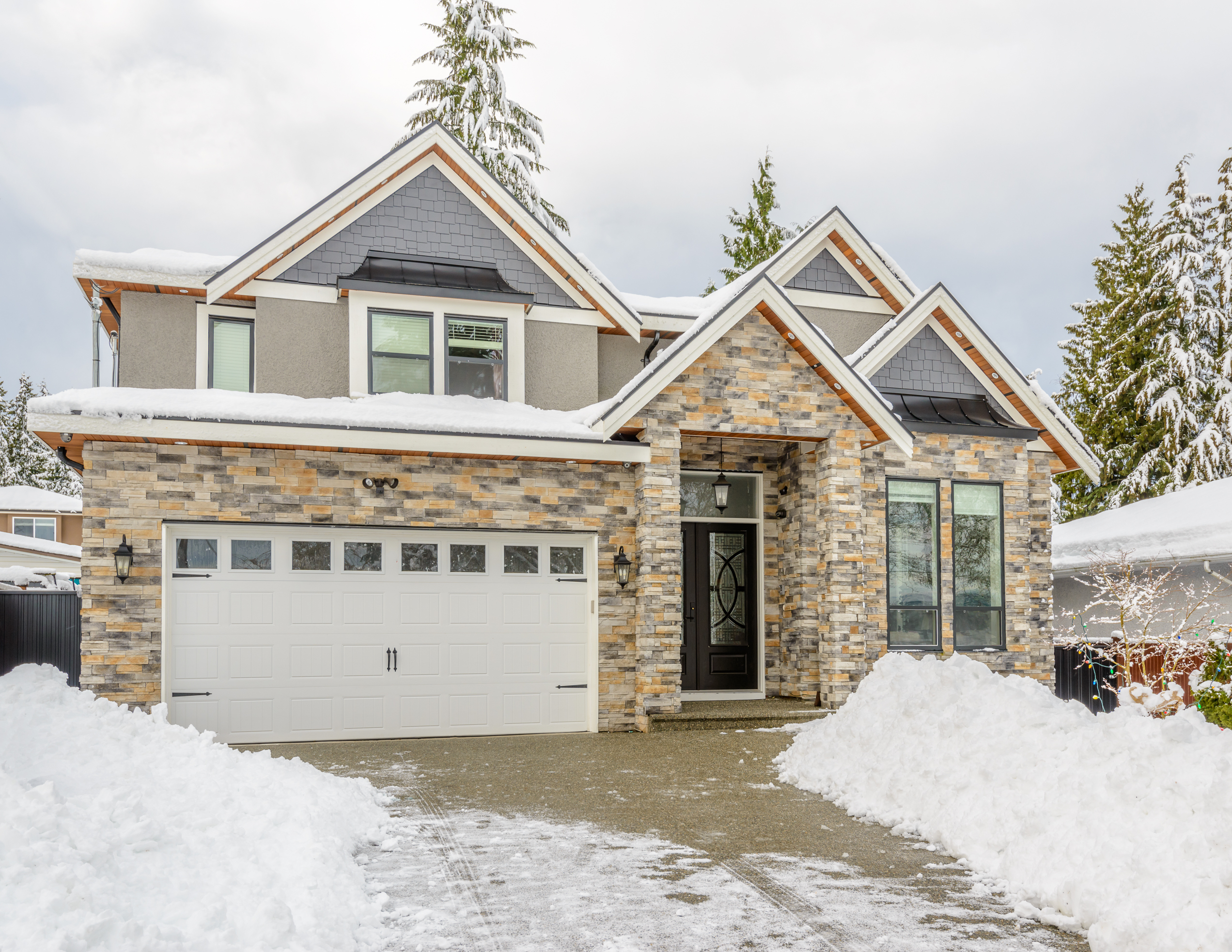 A typical american house in winter. Snow covered.