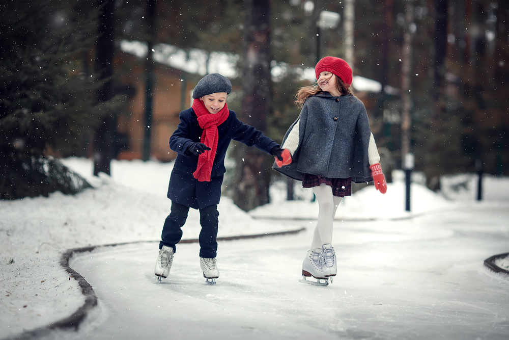 Siblings ice skating