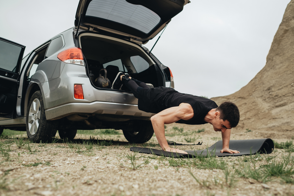 Athletic Man in Black Sportswear Training Open Air Healthy Lifestyle and Outdoors Workout Concept
